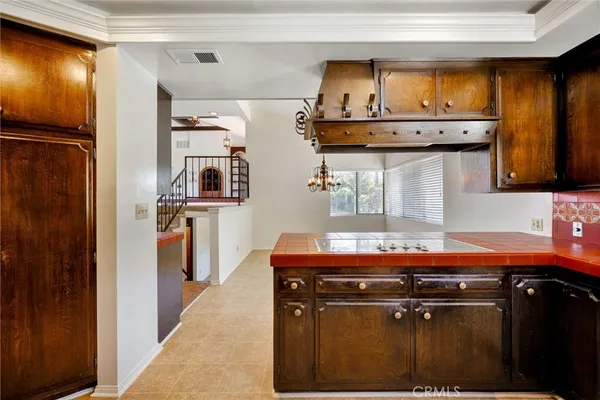 a bathroom with a granite countertop sink a toilet and a mirror