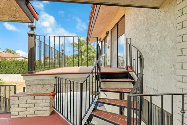 a view of a patio with a yard