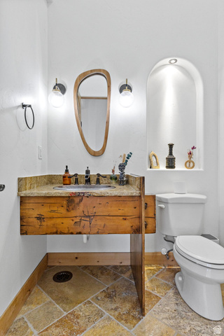 98 Bridge Road Rockville, UT 84763 - Photo 29 of 75 Half Bathroom on Main Floor. Bathroom with stone tile floors and vanity