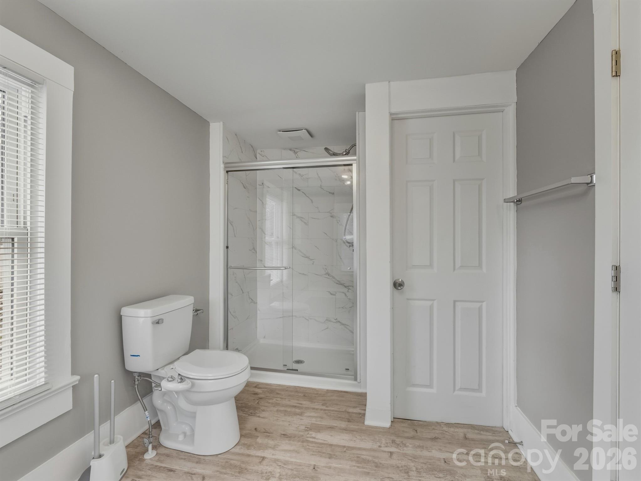 4313 Hovis Road Charlotte, NC 28208 - Photo 15 of 24 a white toilet sitting next to a bathroom sink