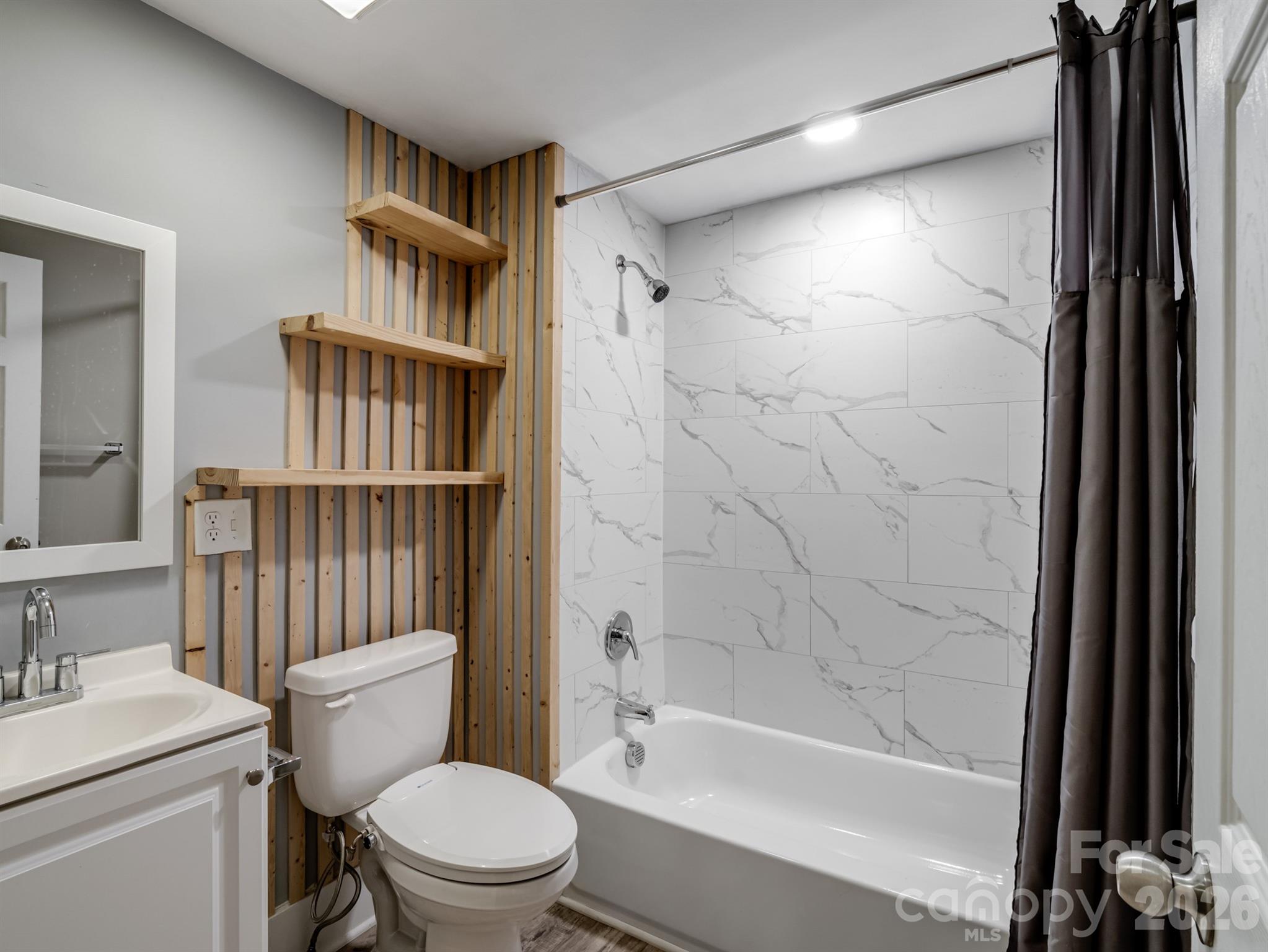 4313 Hovis Road Charlotte, NC 28208 - Photo 17 of 24 a bathroom with a toilet a sink and a bathtub