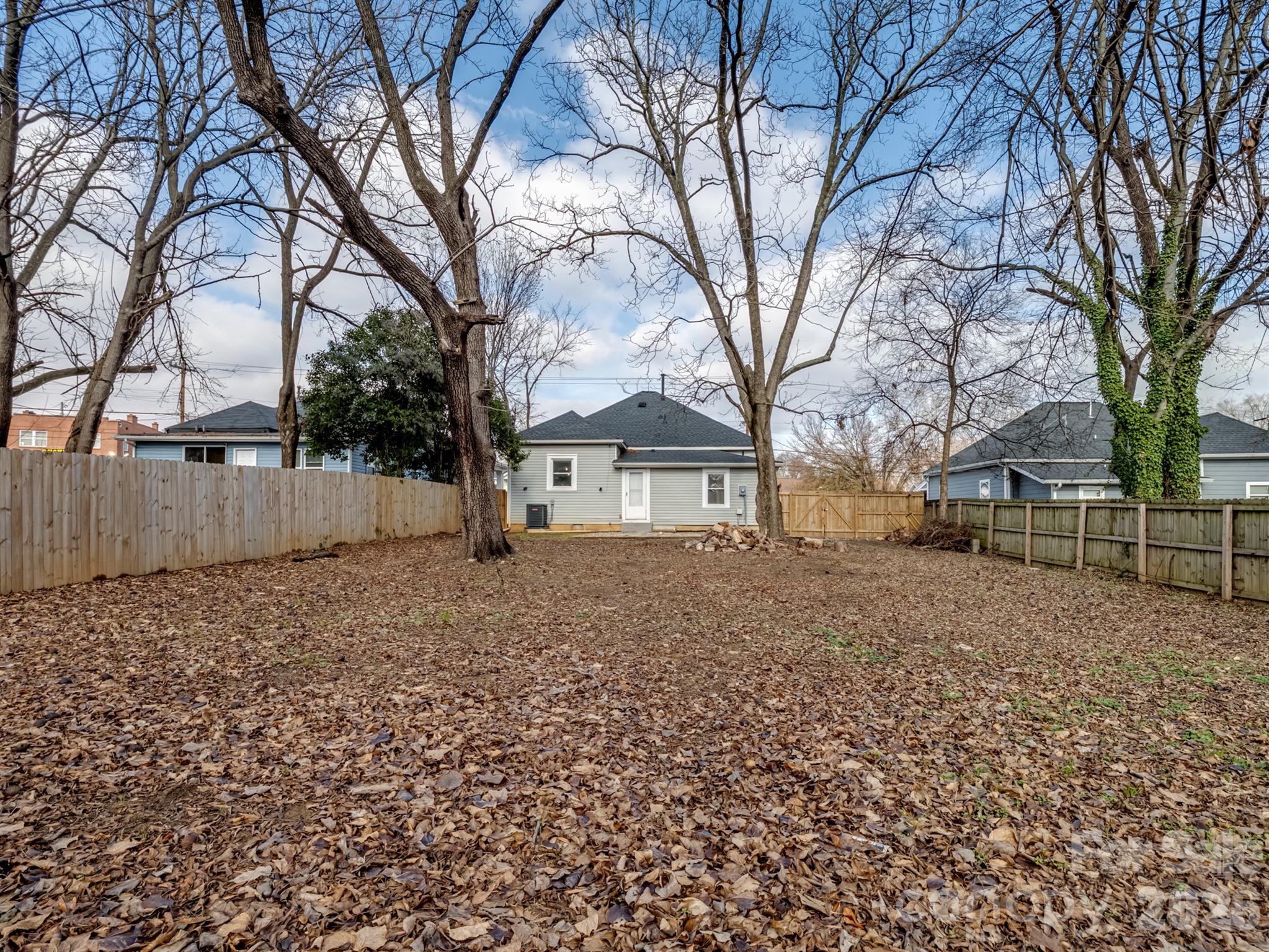 4313 Hovis Road Charlotte, NC 28208 - Photo 20 of 24 a view of a house with a yard covered in snow