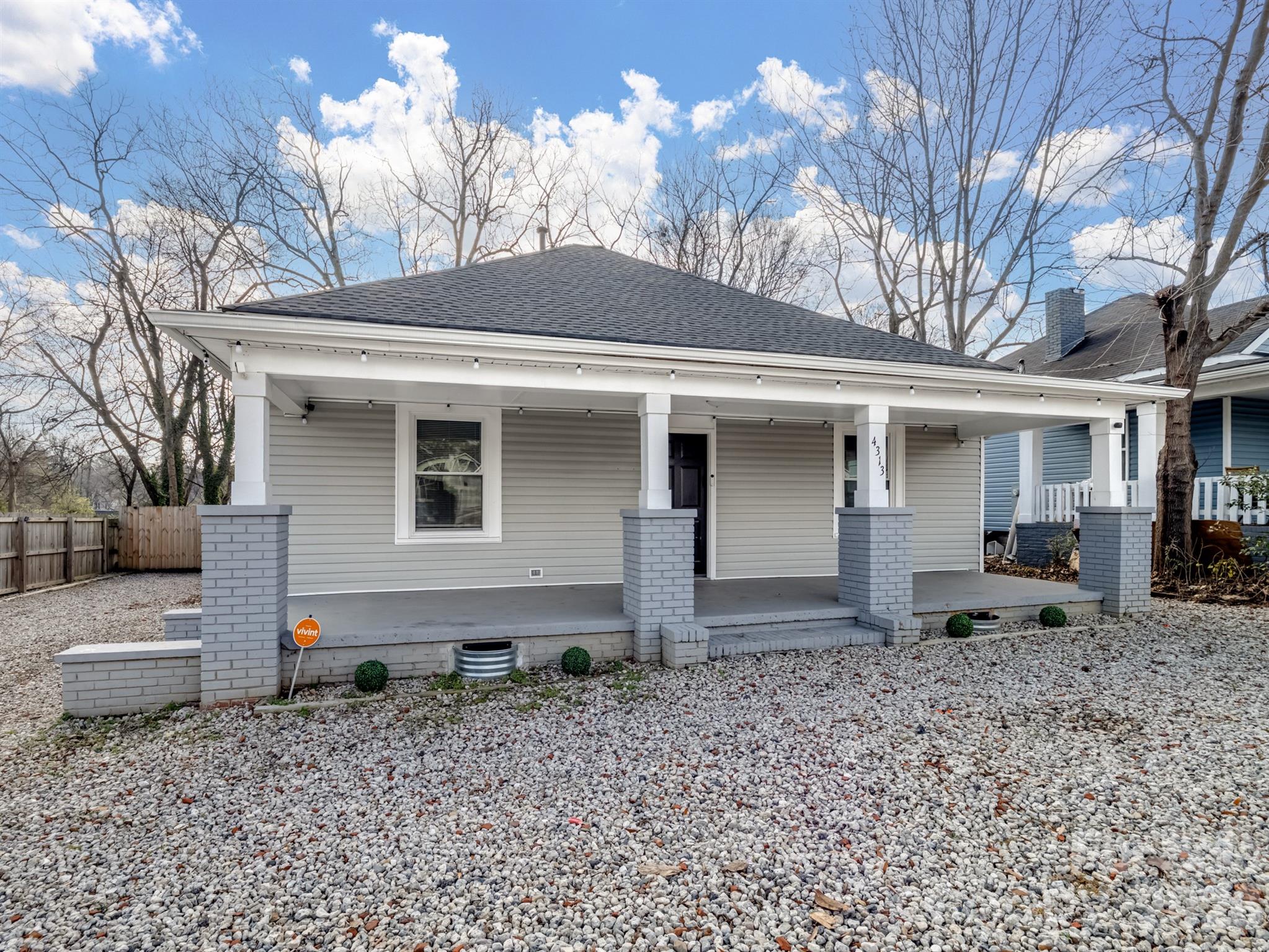 4313 Hovis Road Charlotte, NC 28208 - Photo 21 of 24 a view of a house with a yard and chair