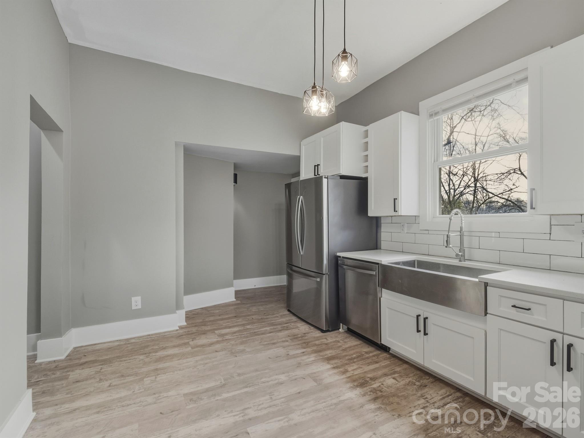 4313 Hovis Road Charlotte, NC 28208 - Photo 24 of 24 a kitchen with stainless steel appliances a refrigerator sink and microwave