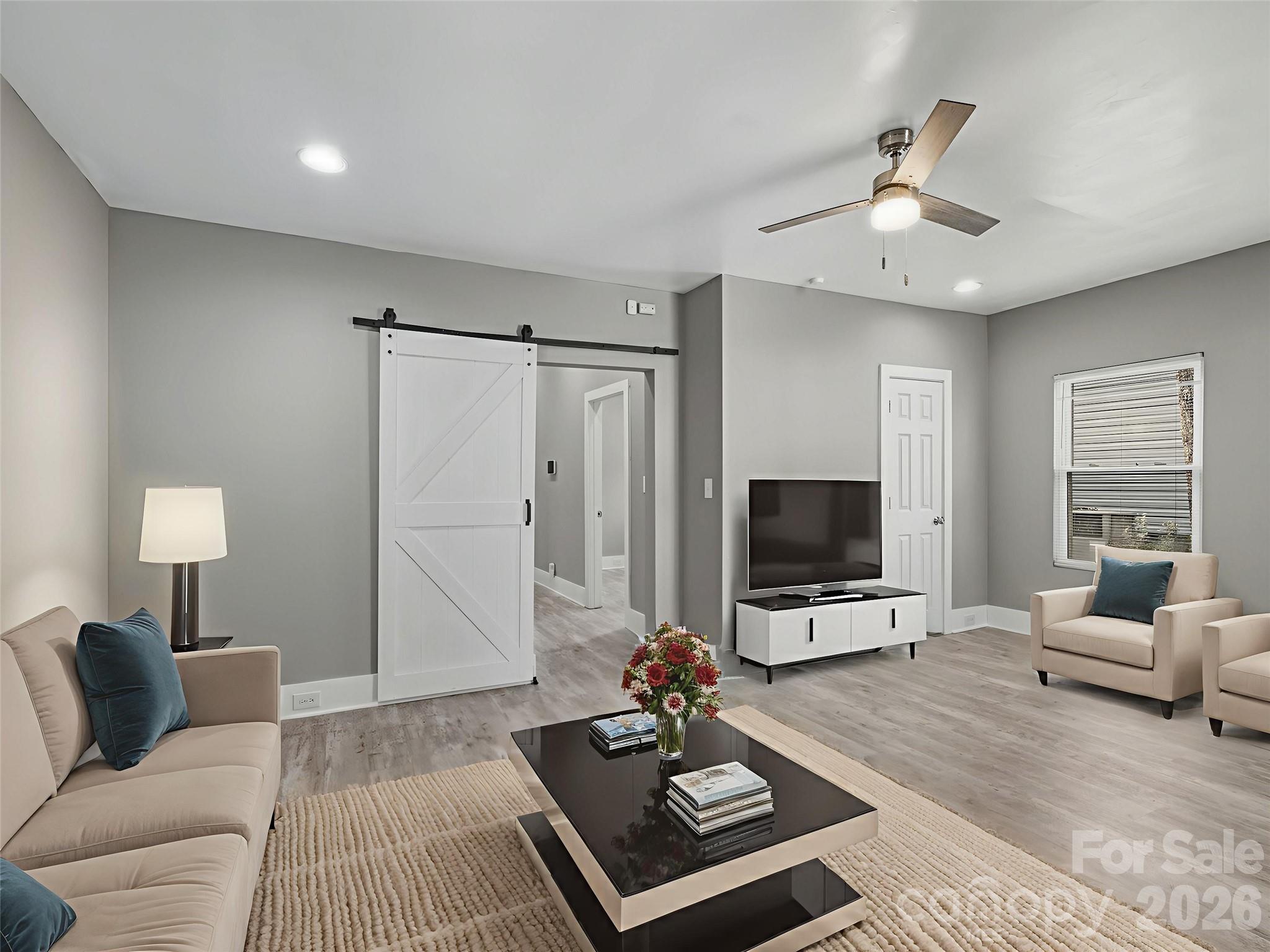 4313 Hovis Road Charlotte, NC 28208 - Photo 3 of 24 a living room with furniture and a flat screen tv