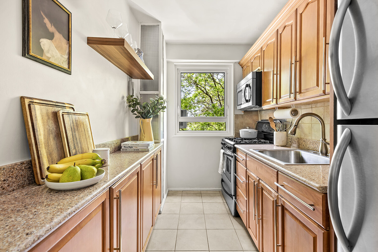 175 Adams Street, Unit 5F Brooklyn, NY 11201 - Photo 4 of 7 a kitchen with stainless steel appliances granite countertop a sink and a refrigerator