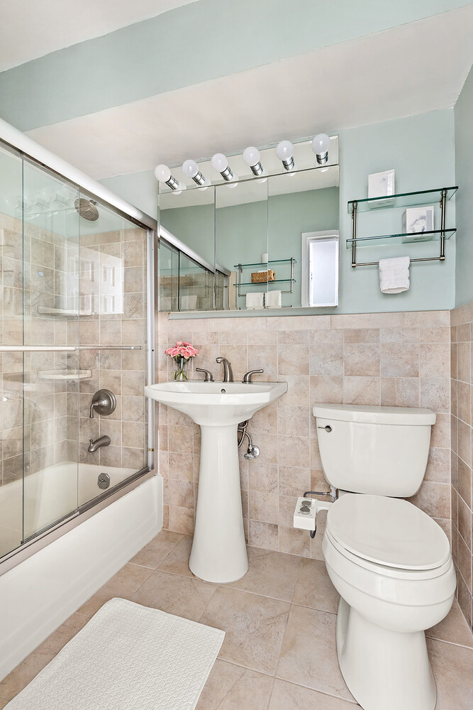 175 Adams Street, Unit 5F Brooklyn, NY 11201 - Photo 6 of 7 a bathroom with a sink toilet and shower