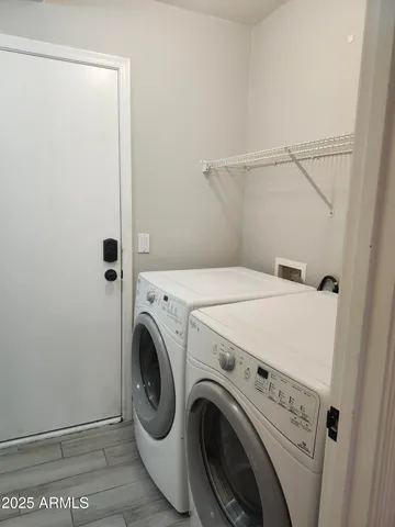 a utility room with dryer and washer