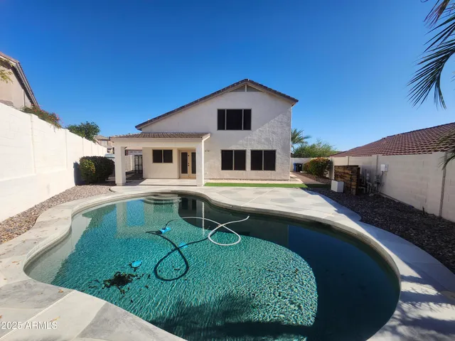 a house view with a swimming pool