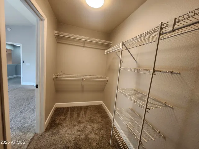 a view of an empty walk in closet