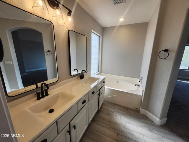 an aerial view of a house with a yard and potted plants