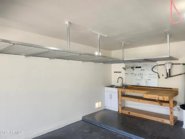 an aerial view of a house with a yard and potted plants