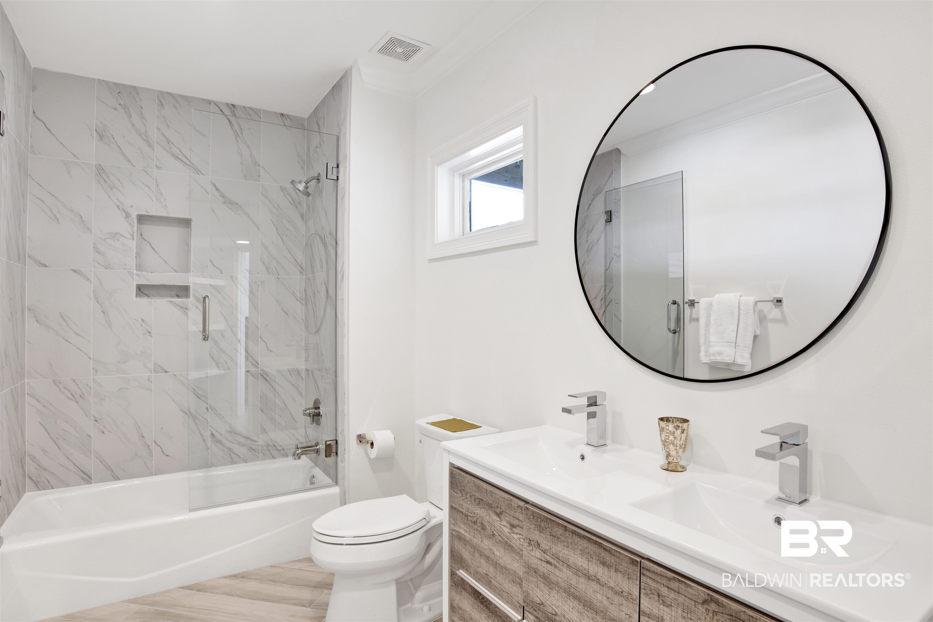 33400 River Road Orange Beach, AL 36561 - Photo 46 of 72 Full bathroom with dual vanity, tiled shower / bath, and toilet