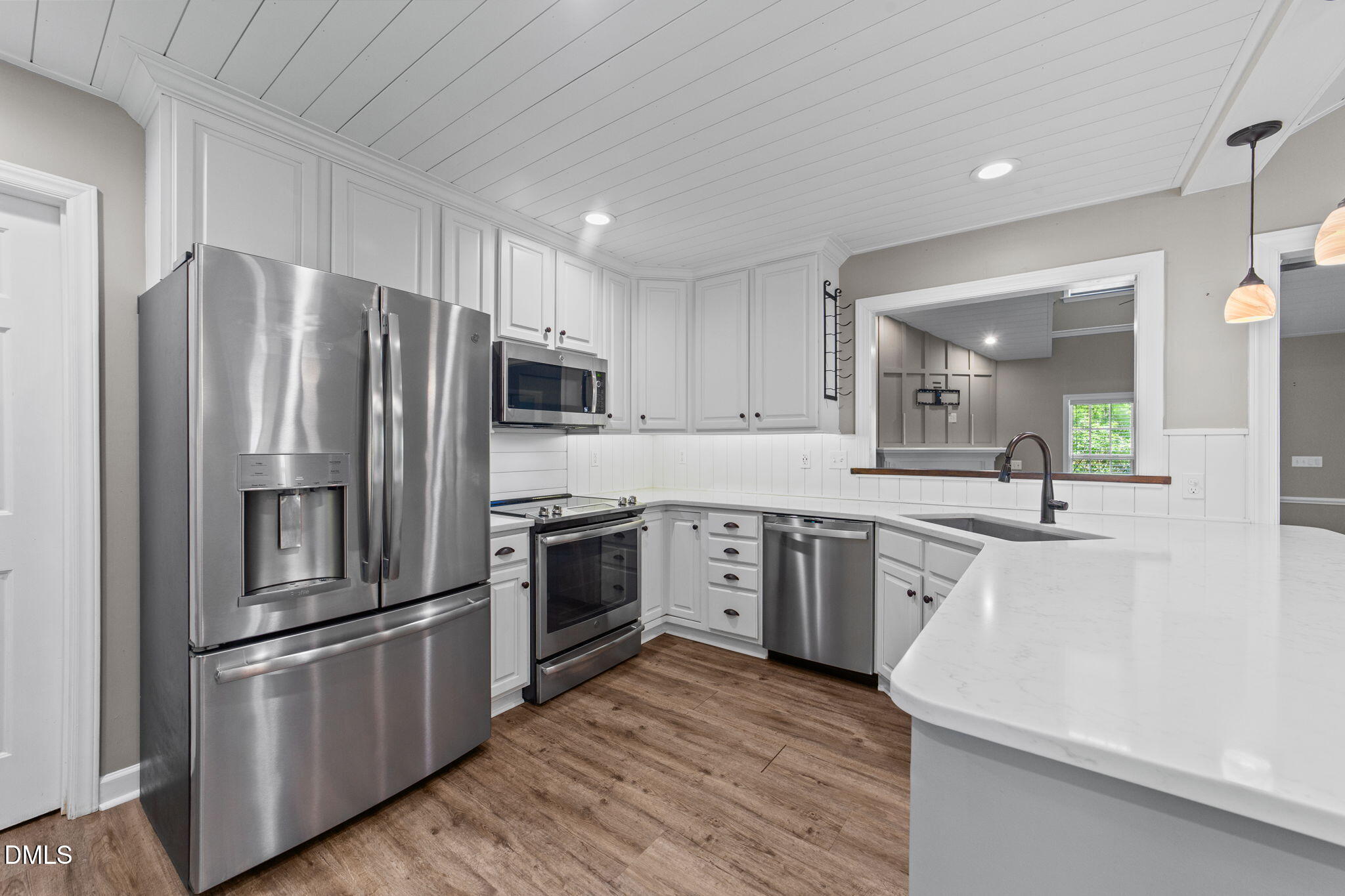 6820 Oviedo Drive Raleigh, NC 27603 - Photo 19 of 50 a large kitchen with cabinets stainless steel appliances and a counter space