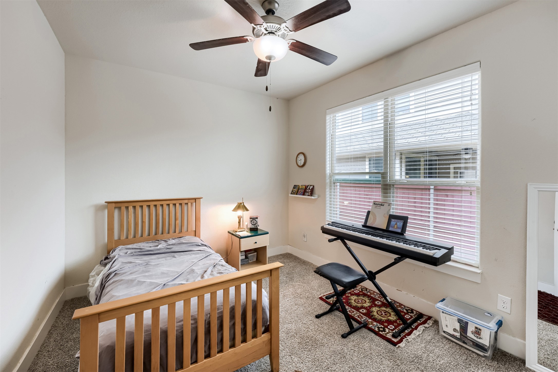 418 High Tech Drive Georgetown, TX 78626 - Photo 21 of 34 Neutral-toned wall paint with a window featuring blinds
