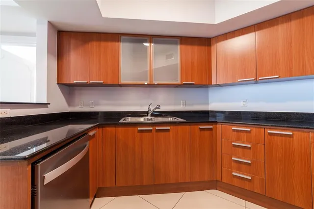 a stove top oven sitting inside of a kitchen