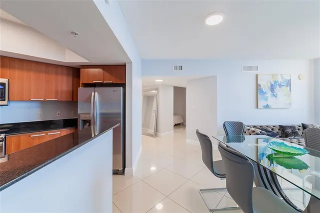 a balcony with chairs and a table