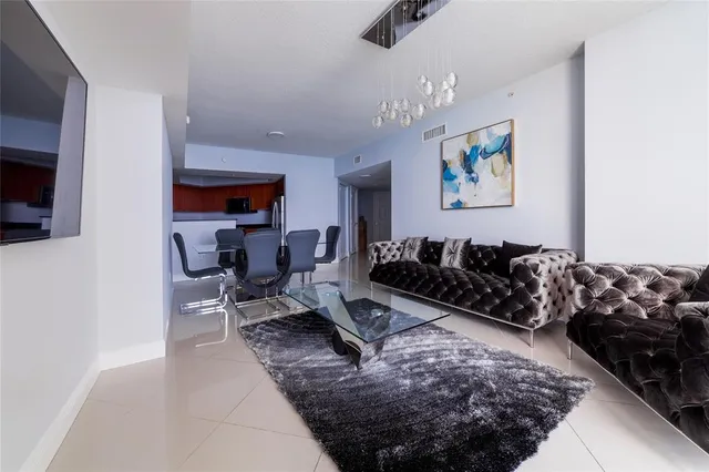 a bedroom with a bed and a wall painting