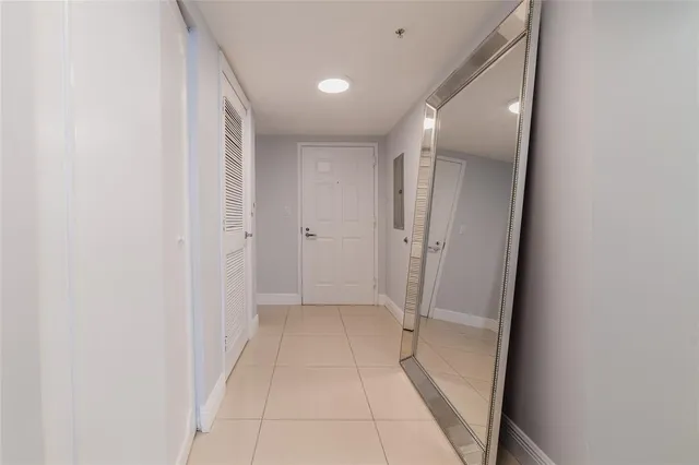 a bedroom with a bed and painting on the wall