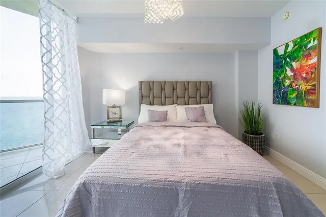 a bed room with a bed and a lamp