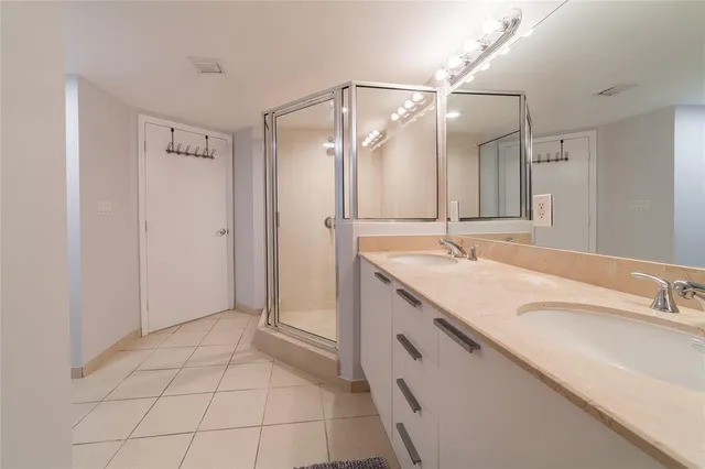 a white toilet sitting next to a white wall