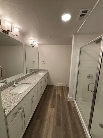 a spacious bathroom with a sink and a mirror