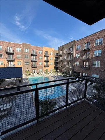 a view of balcony with wooden floor