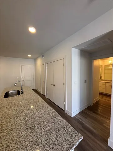 a view of an empty room and wooden floor