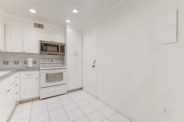 a bathroom with a toilet a sink and vanity