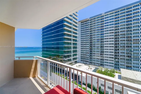 a view of balcony with wooden floor