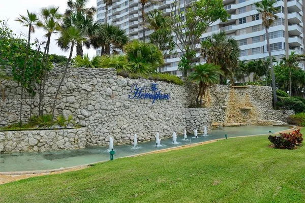 a view of a swimming pool and a yard