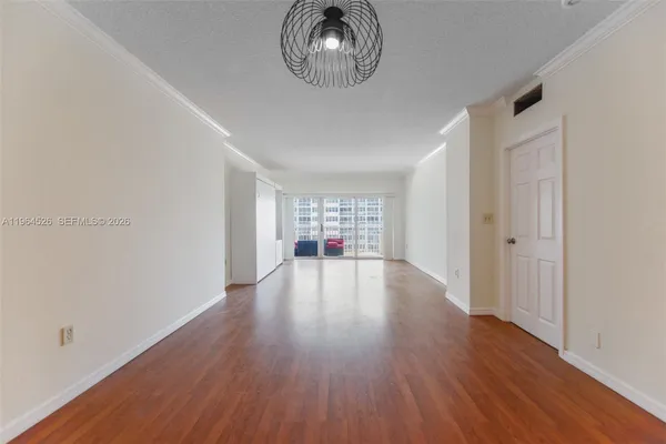 a kitchen with granite countertop cabinets stainless steel appliances and a counter space