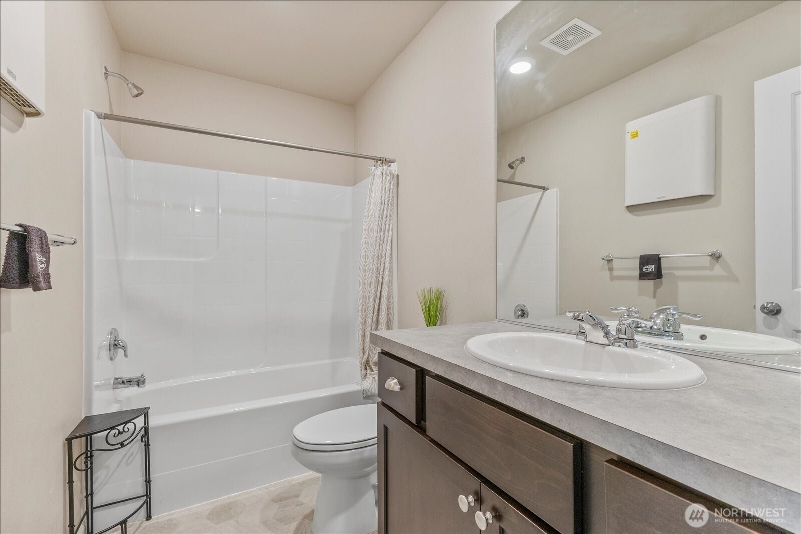 17401 118th Ave Court East, Unit A Puyallup, WA 98374 - Photo 12 of 25 a bathroom with a sink a toilet and shower