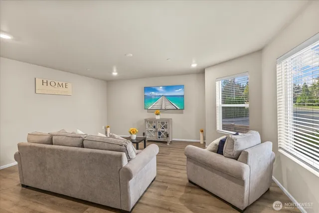 a living room with furniture and windows