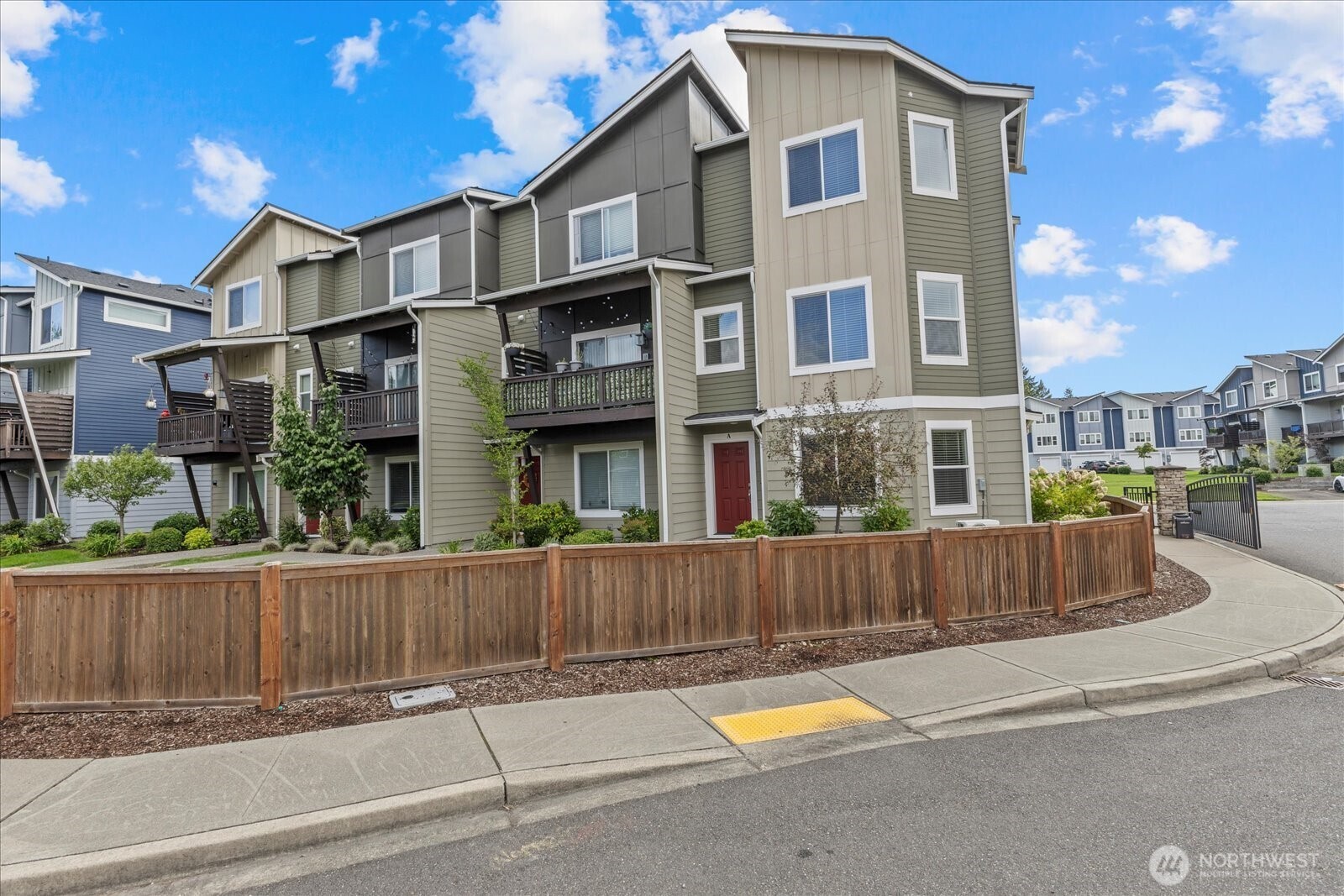 17401 118th Ave Court East, Unit A Puyallup, WA 98374 - Photo 2 of 25 a view of a house with a yard and plants