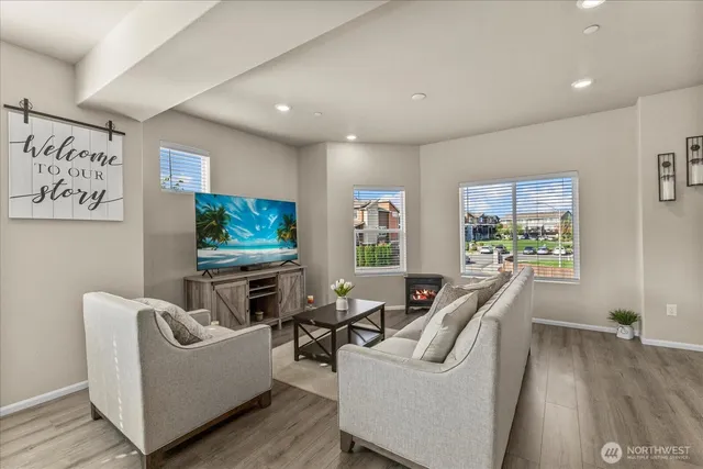 a living room with furniture and a flat screen tv