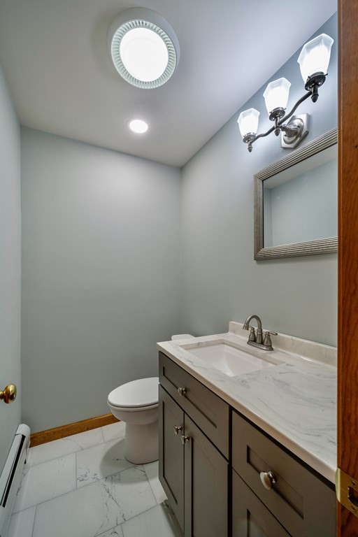 91 Main Road Westhampton, MA 01027 - Photo 16 of 35 a bathroom with a granite countertop toilet sink and mirror