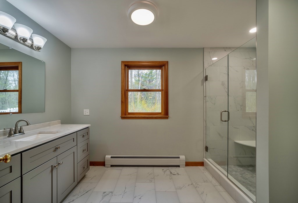 91 Main Road Westhampton, MA 01027 - Photo 18 of 35 a bathroom with a sink a toilet and shower