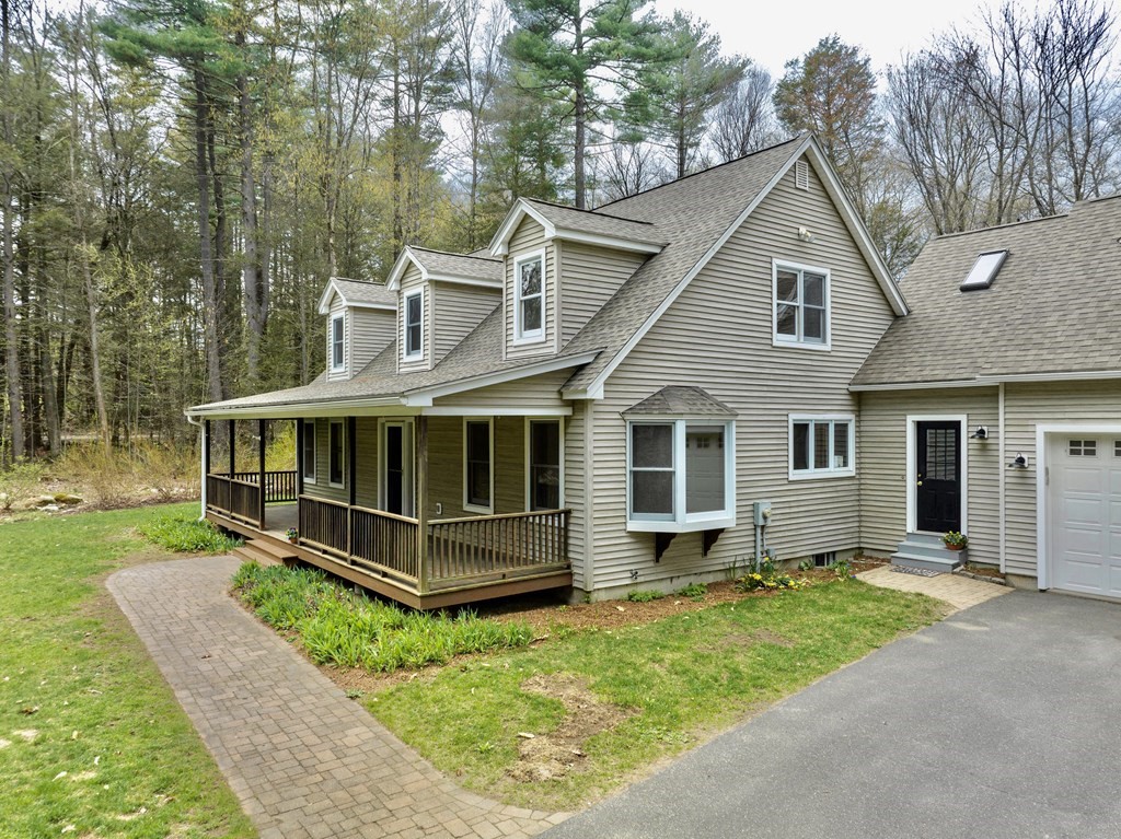 91 Main Road Westhampton, MA 01027 - Photo 2 of 35 a view of a house with a yard and sitting area