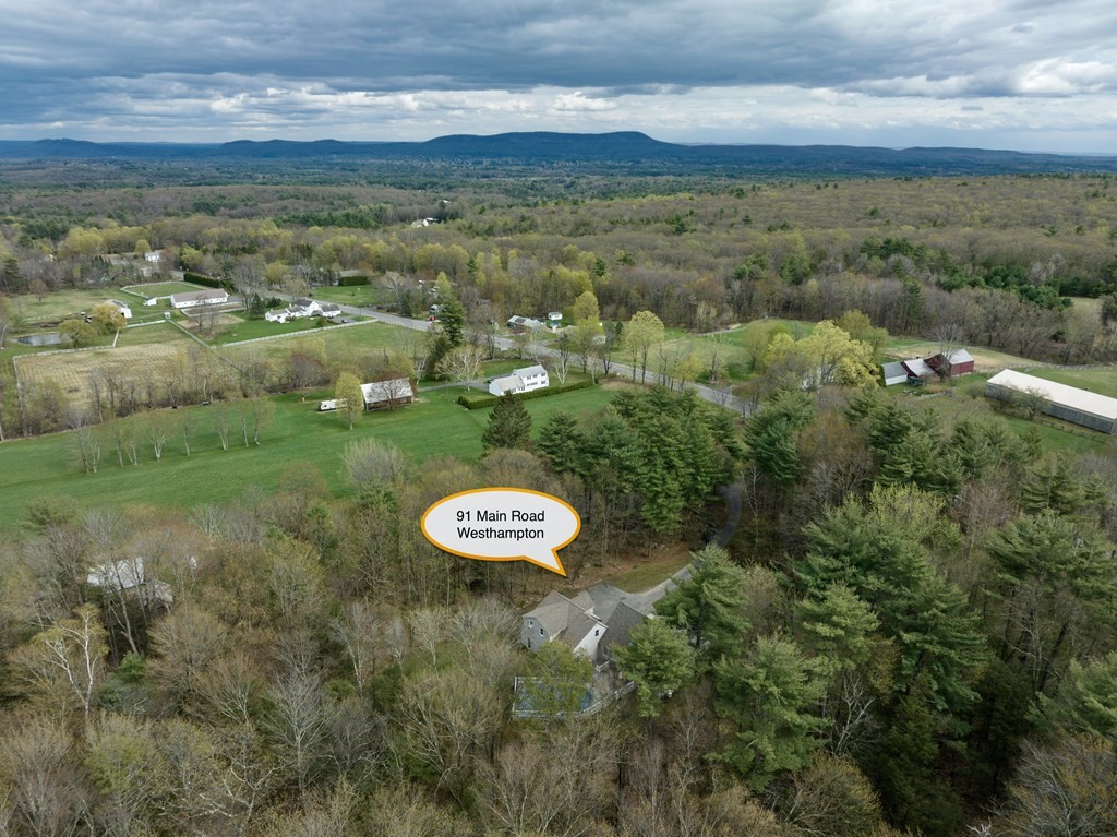 91 Main Road Westhampton, MA 01027 - Photo 5 of 35 an aerial view of a residential houses with outdoor space and trees