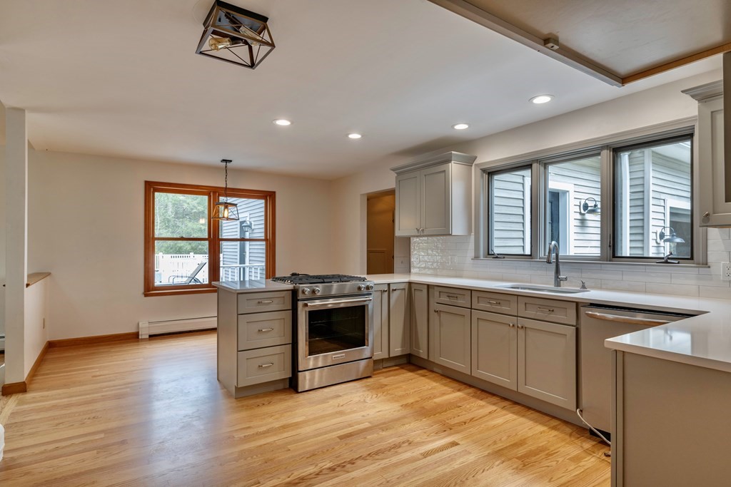 91 Main Road Westhampton, MA 01027 - Photo 8 of 35 a large kitchen with stainless steel appliances granite countertop a stove and a sink