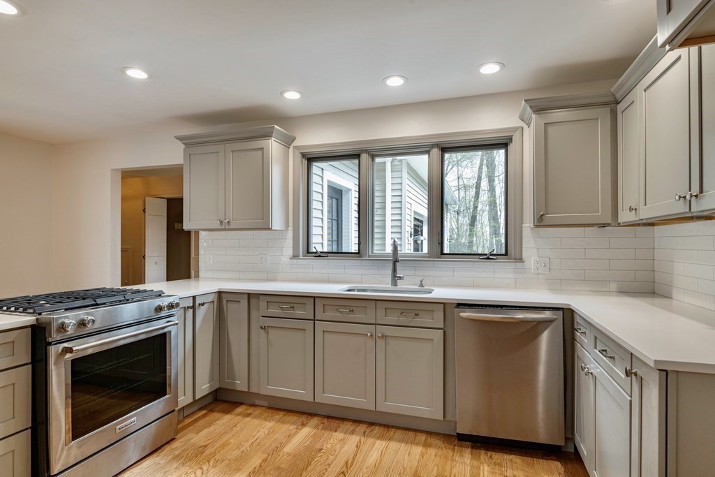 91 Main Road Westhampton, MA 01027 - Photo 9 of 35 a kitchen with a sink stove and cabinets