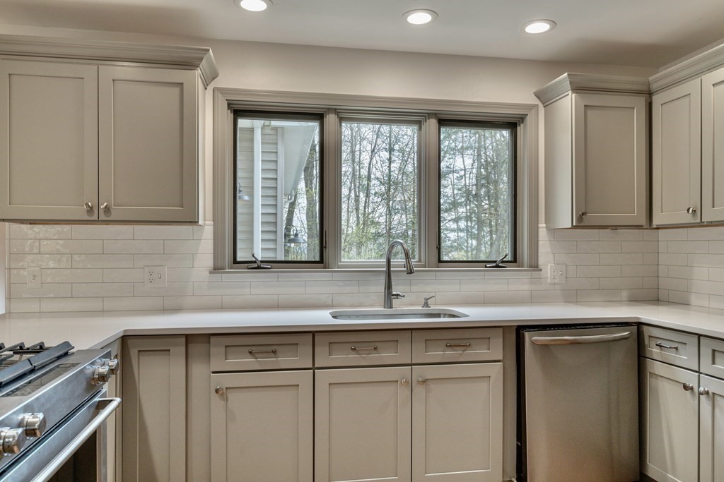 91 Main Road Westhampton, MA 01027 - Photo 10 of 35 a kitchen with granite countertop a sink and a window