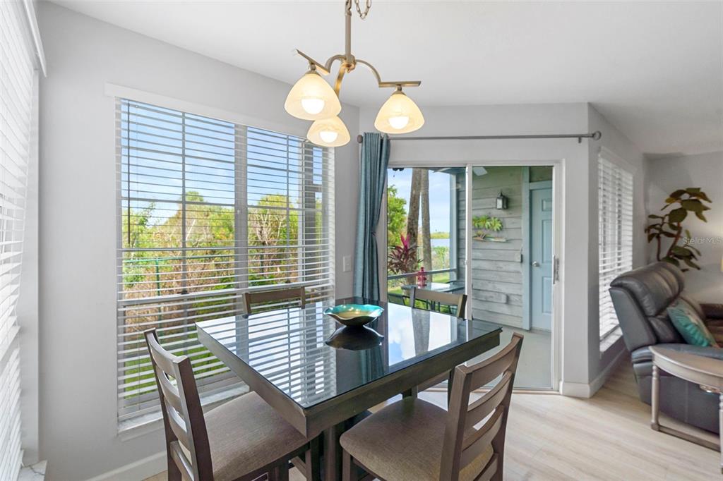 7470 Highway 1, Unit 105 Cocoa, FL 32927 - Photo 11 of 37 a view of a dining room with furniture window and wooden floor