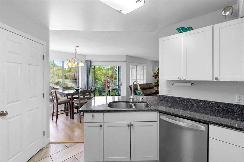 7470 Highway 1, Unit 105 Cocoa, FL 32927 - Photo 13 of 37 a kitchen with counter top space a sink cabinets and appliances