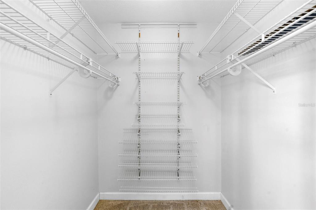 7470 Highway 1, Unit 105 Cocoa, FL 32927 - Photo 23 of 37 a view of walk in closet with empty racks
