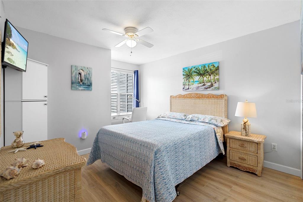 7470 Highway 1, Unit 105 Cocoa, FL 32927 - Photo 24 of 37 a bedroom with a bed and wooden floor