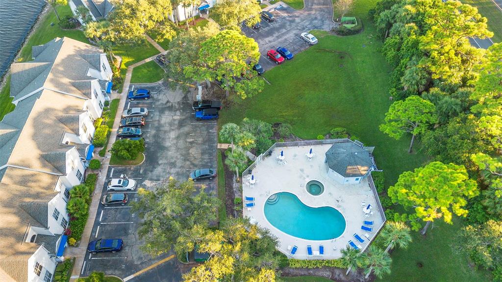 7470 Highway 1, Unit 105 Cocoa, FL 32927 - Photo 34 of 37 an aerial view of a house with a swimming pool and garden