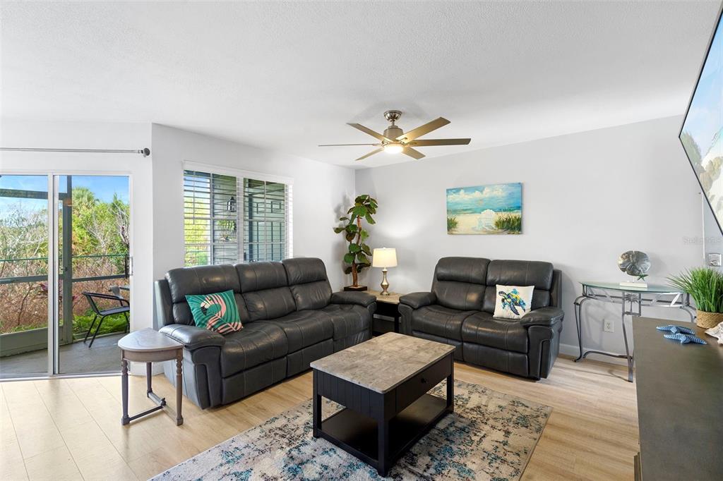 7470 Highway 1, Unit 105 Cocoa, FL 32927 - Photo 6 of 37 a living room with furniture and a large window