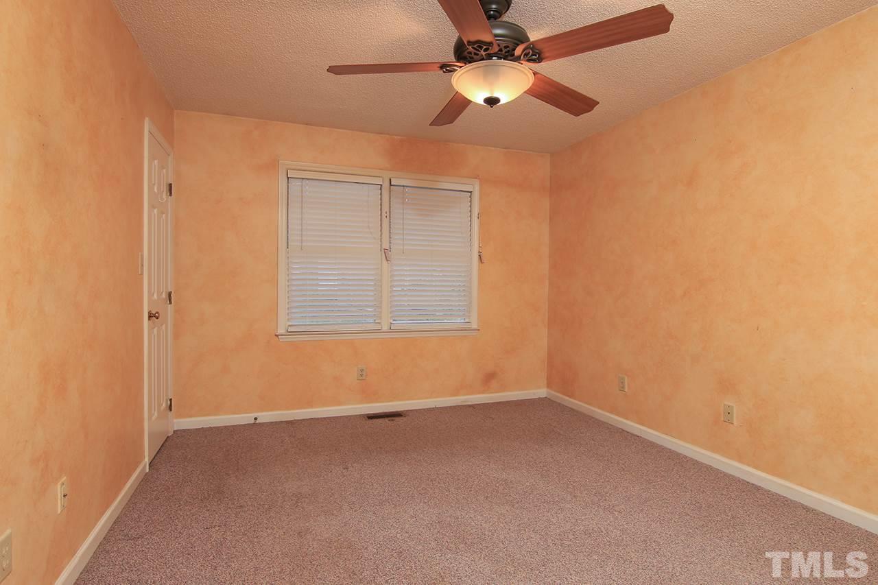 2305 Merganzer Road Raleigh, NC 27616 - Photo 6 of 10 an empty room with a window and a fan